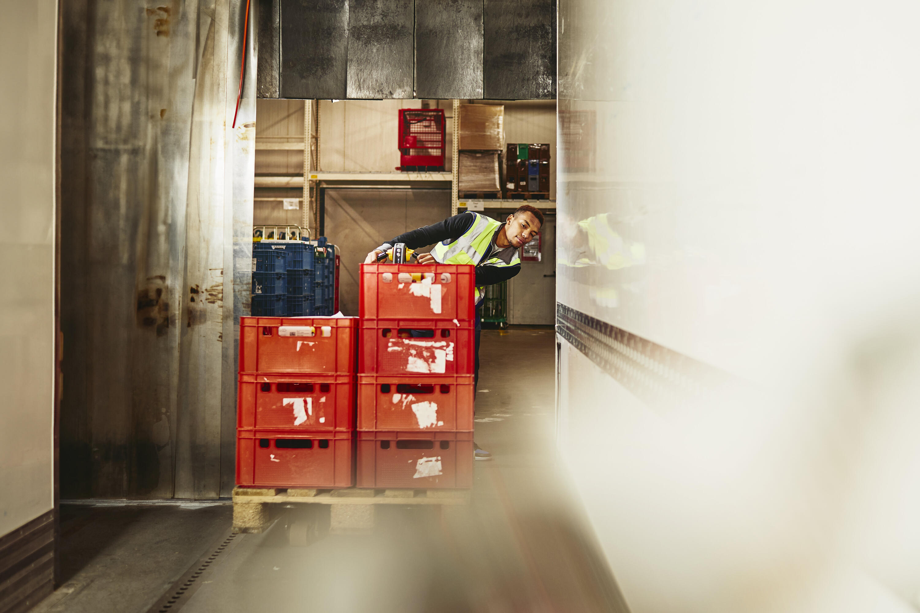 male unloading crates from truck