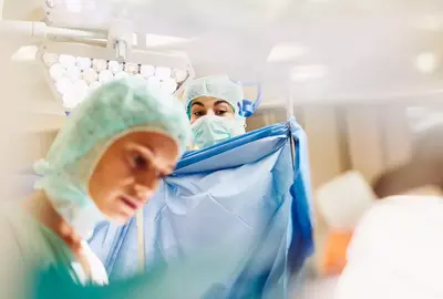 Doctors in a surgery room. 
